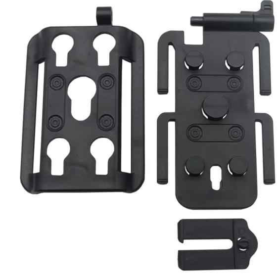 Black mounting bracket kit with three components: a main plate with keyhole cutouts, a mounting arm assembly with thumbscrews, and a separate clip piece, shown on a white background.